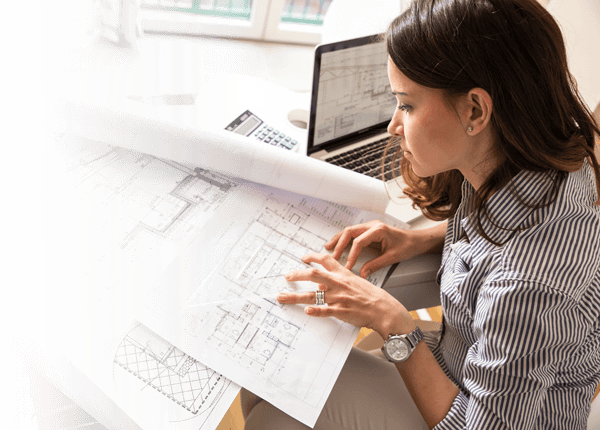 Professional Liability - Architect reviewing plans.